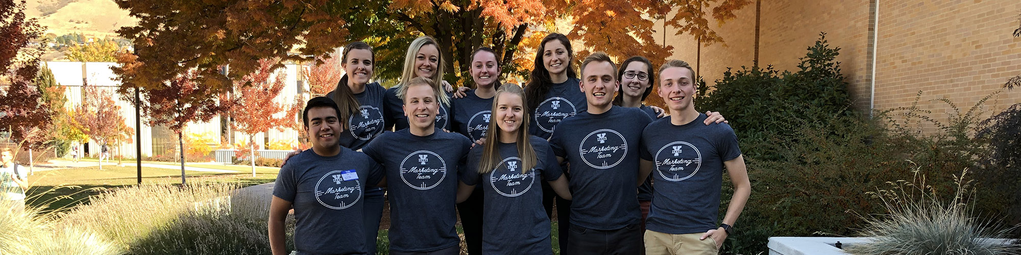 The ten student marketing team stand together for a picture.